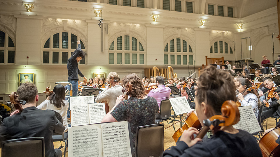 Payare conducting an orchestral rehearsal at the RCM